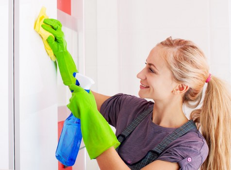 Cleaner preparing carpet cleaning equipment safely